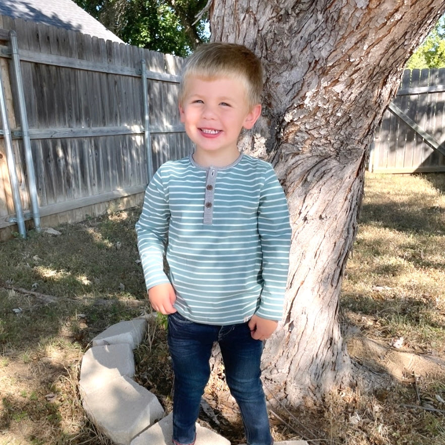Little boy wearing a Blue Stripe Henley