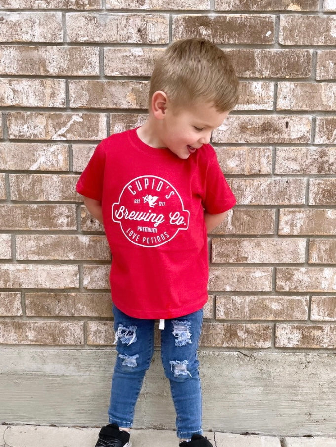 Little boy wearing a Cupid’s Brewing Co. Valentine’s Day Tee